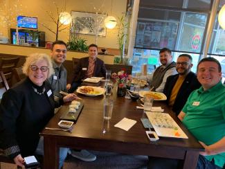 Commissioners, staff, and Sen Wilson having lunch together